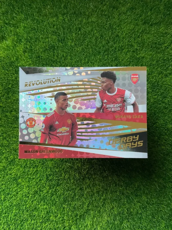 2020-21 Panini Revolution Bukayo Saka & Mason Greenwood Derby Days Disco Parallel